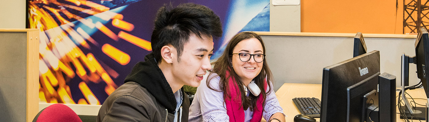 Two students sitting at a computer