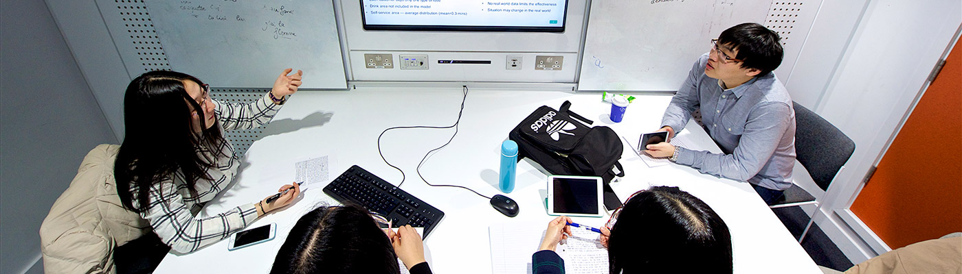 group of students planning in a study room